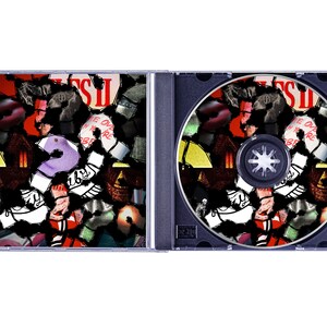 May include: A CD case, open, displaying the disc and the inside cover art. The artwork is a collage of colorful, abstract shapes and the number 2. The CD itself has a black base with the same collage design. The text "COME OVER WHEN YOU'RE SOBER" is visible.