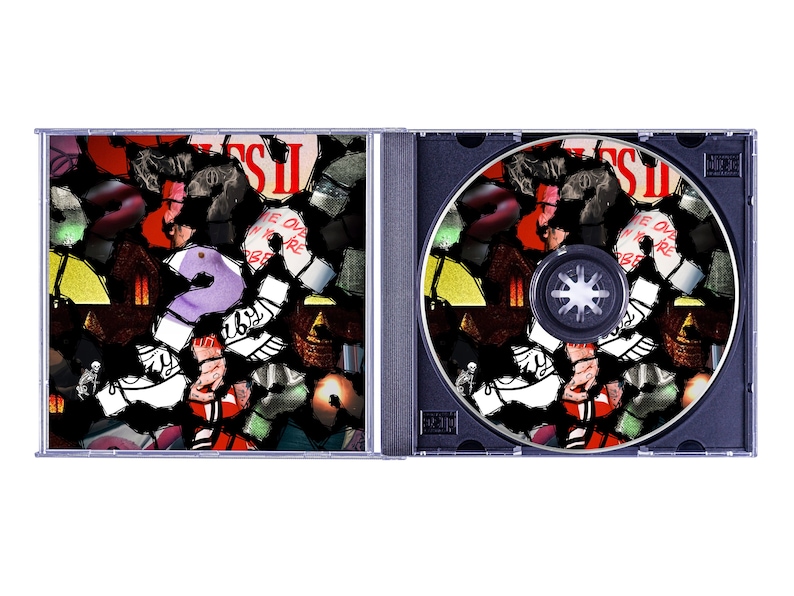 May include: A CD case, open, displaying the disc and the inside cover art. The artwork is a collage of colorful, abstract shapes and the number 2. The CD itself has a black base with the same collage design. The text "COME OVER WHEN YOU'RE SOBER" is visible.