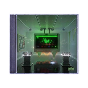 May include: A CD case with a green and black design. The front cover features a digital display with a green heartbeat and the word "Alive" in green text. The display is in a room with a white ceiling and walls. There are two black pedestals on either side of the display.