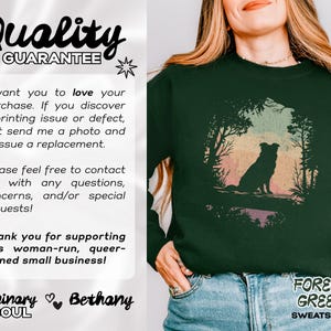 May include: Dark green sweatshirt with a dog silhouette in a forest design. The words "FOREST GREEN SWEATSHIRT" are printed at the bottom right. The image also includes the text "Quality GUARANTEE".