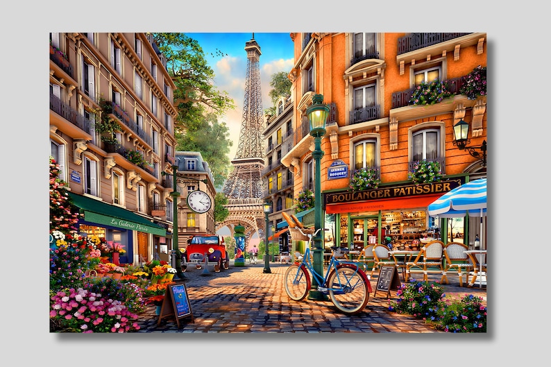 May include: A Parisian street scene with a bakery called "Boulanger Patissier" and a flower shop called "La Galerie Paris". The Eiffel Tower is visible in the background. A bicycle is parked in front of the bakery.
