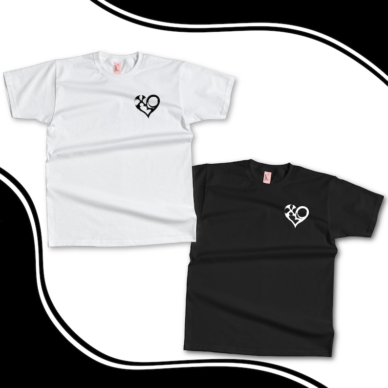 May include: Two short-sleeved t-shirts, one white and one black, are displayed. Each shirt features a heart-shaped design with an XO graphic on the chest. The white shirt is on the left, and the black shirt is on the right.
