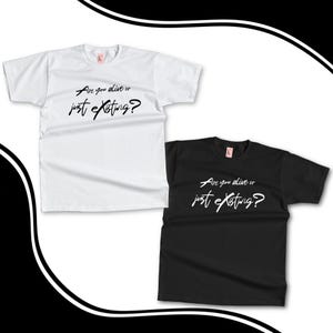 May include: Two t-shirts with the same text printed on them. The text reads "Are you alive or just existing?" The t-shirt on the left is white and the t-shirt on the right is black.