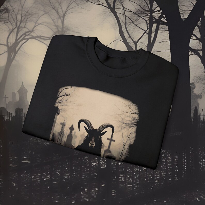 a black t - shirt with a picture of a ram on it