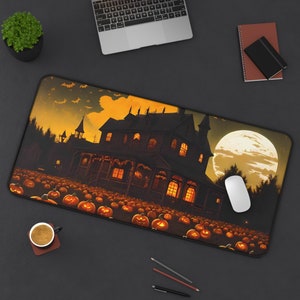 May include: A Halloween-themed mouse mat featuring a spooky house, pumpkins, and a full moon. The house is lit up with orange lights and there are bats flying in the sky.