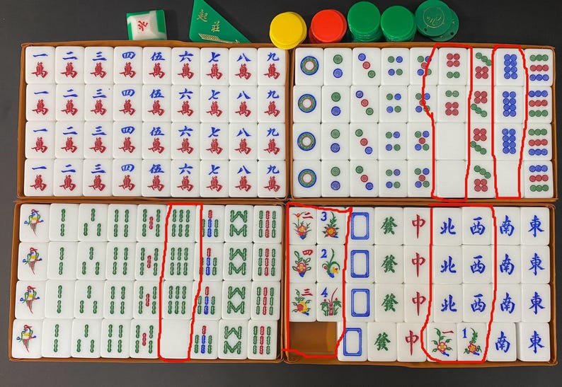 May include: A full Mahjong set, presented in a wooden box, with white tiles marked with Chinese characters and symbols. Includes coloured chips and dice. A traditional board game.