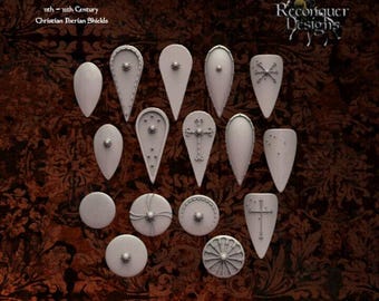 May include: A set of 16 different shield designs, including round and teardrop shapes, with various decorative details. The shields are made of a light gray material and are arranged in a grid pattern. The text "11th - 12th Century Christian Iberian Shields" is visible at the top of the image.