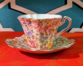 Vintage Fine bone China Piccadilly teacup and saucer, “Springtime” bright colors floral made in England multi-colored daisy field