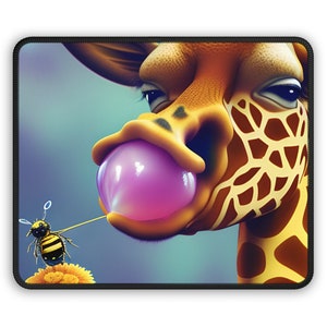 May include: A rectangular mouse mat with a cartoon giraffe blowing a pink bubble. A bee is attached to the bubble with a string. The giraffe has brown spots and a yellow and orange colour scheme. The background is a soft blue.