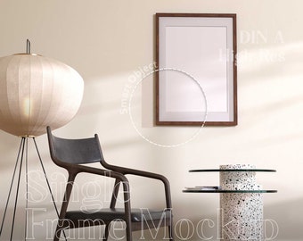 May include: A single frame mockup featuring a brown wooden frame, a white mount, and a white background. The frame is hanging on a wall with a chair and a side table in the foreground. The text "DIN A High Res" is visible in the top right corner of the image.