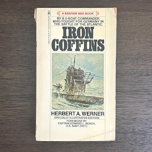 May include: A vintage paperback book titled "Iron Coffins" by Herbert A. Werner. The cover features a U-boat illustration and the text "A Bantam War Book." The book is a memoir by a U-boat commander during WWII.