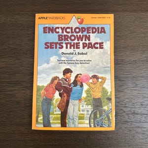 Encyclopedia Brown Sets the Pace - Vintage 1982 Paperback Book by: Donald J. Sobel