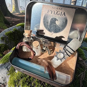 May include: A set of three ceramic mugs with a speckled, matte finish. The mugs are in shades of cream, light brown, and dark brown. Each mug has a simple, minimalist design, perfect for coffee or tea.