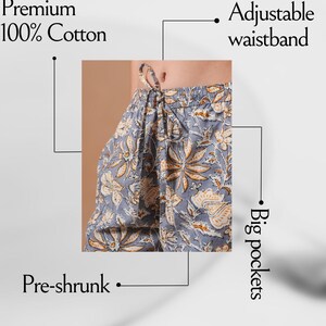 Handmade floral print cotton lounge pants with bright orange flowers on gray fabric – comfy, breathable sleep pants designed with elastic waist, drawstring closure, and convenient pockets, ideal for gifts for flower lovers, book lovers, and modern cotton gift ideas for sleepwear and casual lounging.