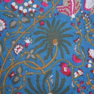Comfy and breathable cotton slacks with elastic waistband, drawstring, and spacious pockets; vibrant pink flower and butterfly print, perfect self-care or gift for flower lovers.
