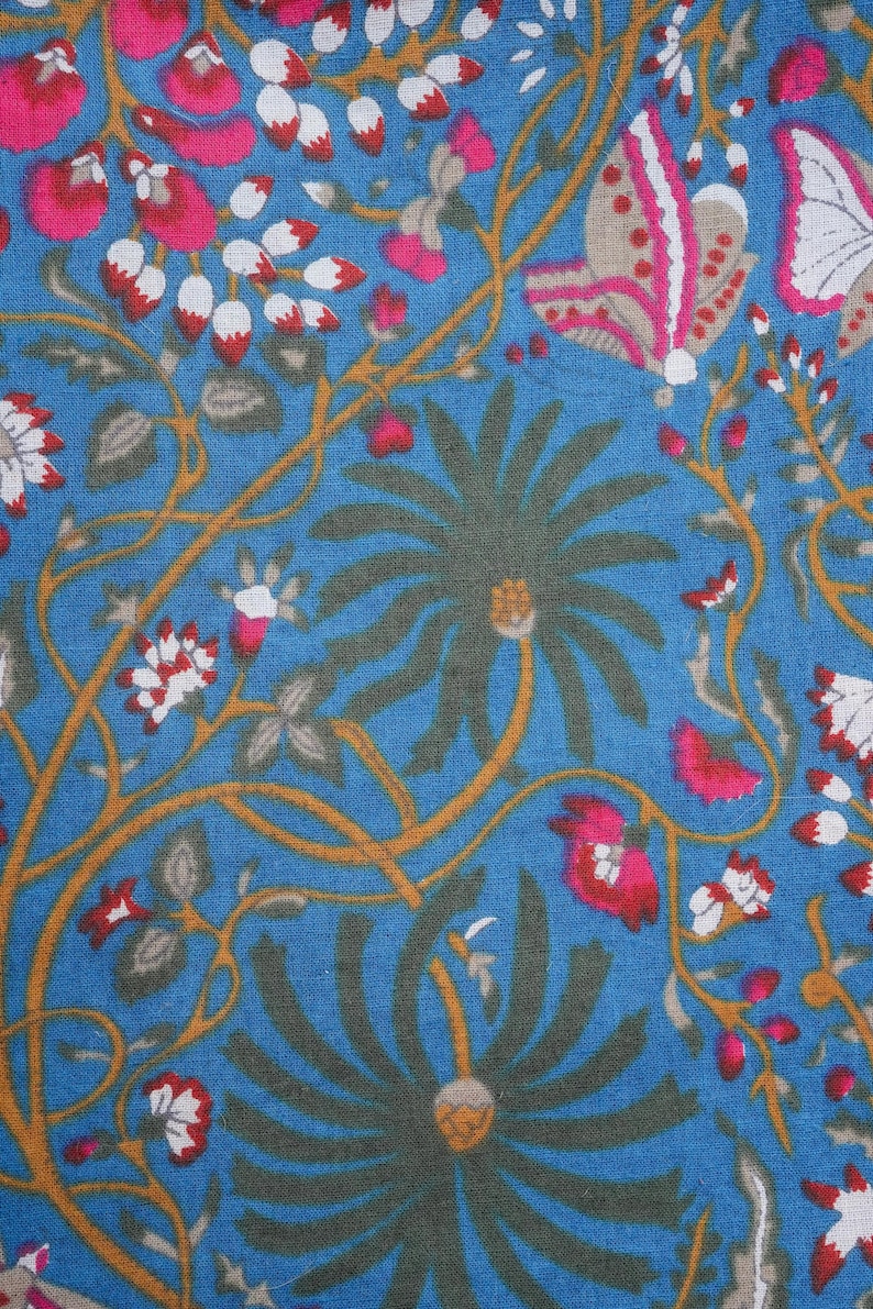 Comfy and breathable cotton slacks with elastic waistband, drawstring, and spacious pockets; vibrant pink flower and butterfly print, perfect self-care or gift for flower lovers.