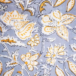 Modern and unique women’s cotton pajama bottoms in gray with bold orange floral pattern – soft, lightweight jammies featuring elastic waistband, drawstring, and roomy side pockets, perfect as trendy lounge & sleepwear, cooling sleep pants for pajama parties, and special cotton anniversary gifts for nature enthusiasts.