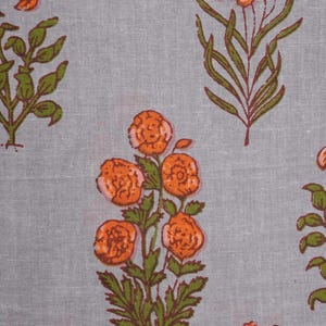 Women’s handmade cotton pajama bottoms in gray with orange floral design – breathable, soft, and lightweight with an elastic waistband and roomy pockets, making them perfect sleep pajamas, comfy lounge pants for warm nights, or trendy cotton gift ideas for nature lovers and modern homebodies.