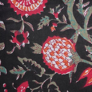 Women’s 100% cotton sleep trousers in a striking red-on-black floral pattern – lightweight and breathable, featuring a relaxed fit, elastic waistband, drawstring closure, and roomy pockets, ideal for lounging, traveling, or gifting as trendy cotton gift ideas or 2nd anniversary presents.