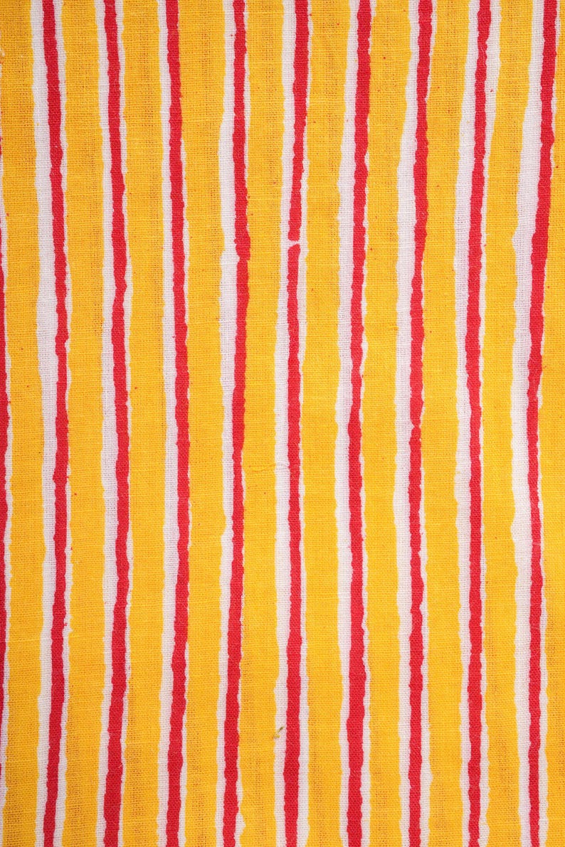 Bold striped women’s lounge pants in red and yellow with breathable 100% cotton fabric – comfy pajama trousers featuring side pockets, elastic waistband, and drawstring, ideal for tropical boho fashion lovers, unique cotton gift ideas, or thoughtful 2nd anniversary gifts for anyone who loves soft, handmade loungewear.