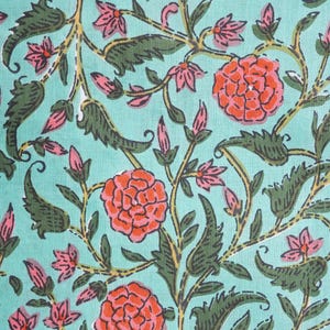 Comfortable and breathable cotton pajama bottoms with bright orange flowers on green background – relaxed fit sleep pants designed with elastic waist, drawstring closure, and deep side pockets, ideal for floral print clothing lovers, gifts for flower lovers, book lovers, and stylish cotton gift ideas for self-care and comfort.