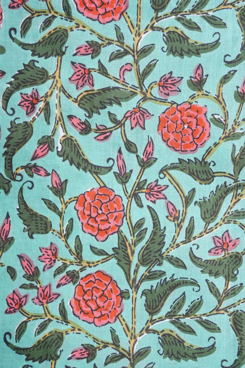 Comfortable and breathable cotton pajama bottoms with bright orange flowers on green background – relaxed fit sleep pants designed with elastic waist, drawstring closure, and deep side pockets, ideal for floral print clothing lovers, gifts for flower lovers, book lovers, and stylish cotton gift ideas for self-care and comfort.
