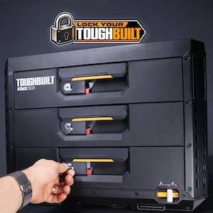May include: A black ToughBuilt StackTech three-drawer storage unit with a lockable mechanism on each drawer. The unit features the ToughBuilt logo and a Lock Your ToughBuilt graphic at the top. A key is inserted into the bottom drawer lock.
