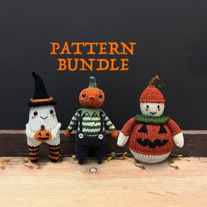 May include: A set of three knitted Halloween amigurumi toys. A white ghost with a black hat holds a small orange pumpkin. A green and orange pumpkin with a striped shirt and overalls. A brown and orange pumpkin with a white face and a green hat.