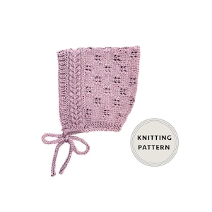 May include: A mauve-coloured knitted bonnet with an openwork design and a cable knit panel. The bonnet has a tie closure. The words "KNITTING PATTERN" are in a circle.