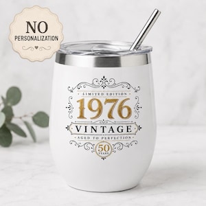 May include: A white stainless steel tumbler with a metal straw, featuring black and gold text that reads Limited Edition 1976 Vintage Aged to Perfection 50 Years. A beige scalloped badge in the top left corner displays the text No Personalization.