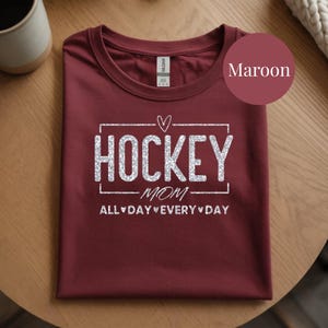 Premium Hockey Mom Tee Glitter Vinyl Graphic Cotton Shirt Material Comfortable Fit Soft Fabric Construction Game Day Essential Practice Session Outfit Rink Side Wear Ice Hockey Support Team Spirit Apparel Proud Parent Gift Perfect Present
