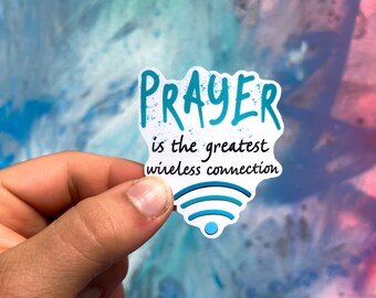 May include: A white sticker with blue text that reads "PRAYER is the greatest wireless connection" and a blue wifi symbol.