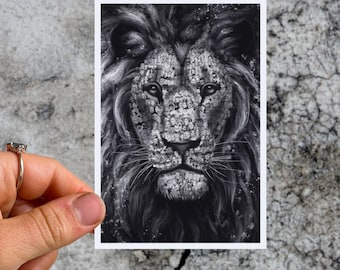 May include: A black and white illustration of a lion's face. The lion's fur is made up of many small, detailed images of faces.