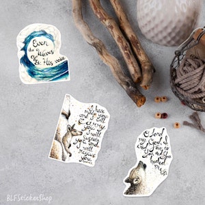 May include: Three watercolor stickers with inspirational quotes and illustrations. The first sticker features a blue wave with the text "Even the Waves obey His voice". The second sticker features a kangaroo with a joey and the text "I have made you and I will carry you. I will sustain you and I will rescue you". The third sticker features a wolf howling at the moon with the text "O Lord my God, I cried out to You and You healed me".