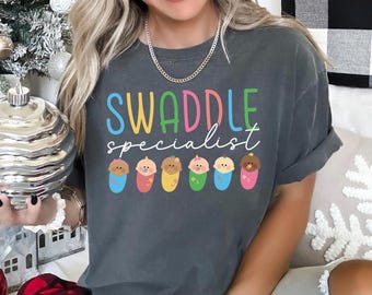Swaddle Specialist Shirt, Comfort Colors, Labor And Delivery Nurse Shirt, NICU Nurse Shirt, Baby Nurse Shirt, Neonatal ICU Nurse Tee 183474