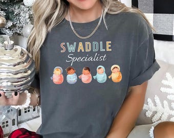 Swaddle Specialist Shirt, Comfort Colors, Labor And Delivery Nurse Shirt, NICU Nurse Shirt, Baby Nurse Shirt, Neonatal ICU Nurse Tee 183492