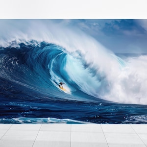 May include: A surfer rides a large, blue wave with white foam. The wave is breaking and the surfer is in the barrel of the wave.