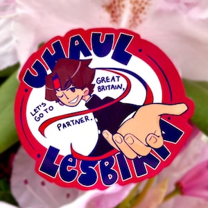 May include: A sticker with a cartoon illustration of a person reaching out, with text that reads "UHAUL GREAT BRITAIN, LET'S GO TO PARTNER. LESBIAN.". The sticker has a red and white border with blue text.