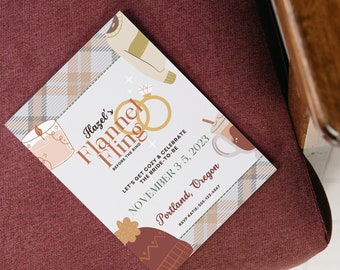 Könnte beinhalten: Eine weiße Karte mit braunem und beigefarbenem Karomuster. Die Karte trägt den Text "Hazel's Flannel Fling" und "Let's get cozy & celebrate the bride-to-be" mit dem Datum "November 3, 2023" und dem Ort "Portland, Oregon".