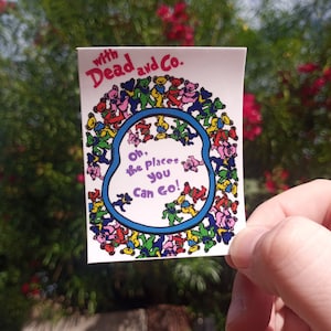 May include: A sticker with a colorful illustration of dancing bears and the text "With Dead and Co. Oh, the places you can go!"