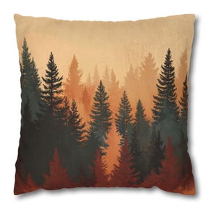 May include: Square throw pillow with a forest scene. The design features a layered forest of evergreen trees in shades of dark green, red, and orange against a light orange background. The pillow has a soft, textured appearance.