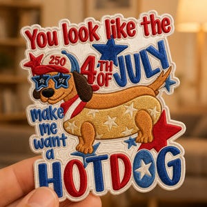 May include: Embroidered patch featuring a dachshund dressed as a hot dog, wearing sunglasses and a patriotic scarf. Text includes "You look like the 4th of July" and "make me want a HOTDOG". Stars and red, white, and blue colors.