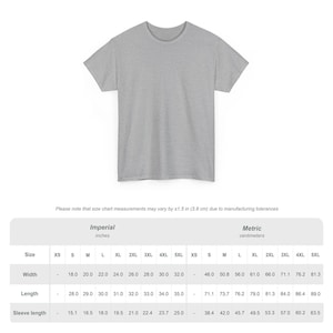 May include: A heather gray t-shirt with a crew neck. The image includes a size chart with measurements in inches and centimeters. The chart shows the width, length, and sleeve length for various sizes, from XS to 5XL.