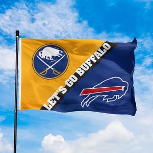 May include: A rectangular flag attached to a black pole, featuring a diagonal split between gold and blue sections. The gold side displays a white buffalo emblem with crossed swords, while the blue side shows a red and white buffalo logo.