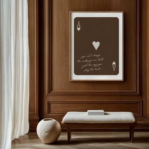 May include: A framed Ace of Hearts playing card art print. The card is brown with white heart symbols and text that reads "you can't change the cards you are dealt, just the way you play the hand."