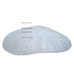 Hand Tufted Viscose Rug: Irregular Pebble Shape, Subtle Line Texture