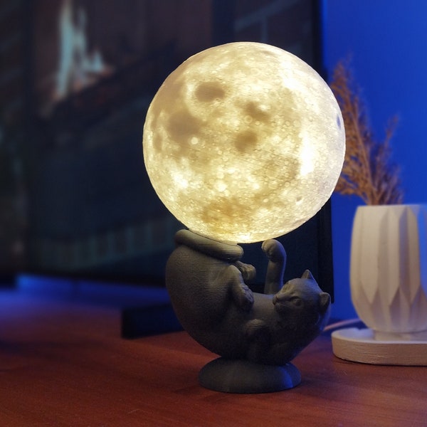Decoratieve Nachtlamp met de figuur van een kat die de Maan vasthoudt