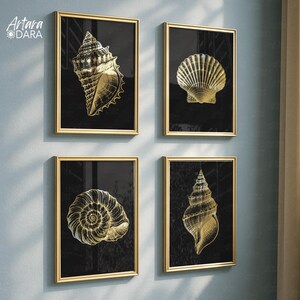 May include: Four framed wall art pieces featuring gold seashell illustrations on a black background. The frames are gold, and the art pieces are arranged in a square formation. The art pieces are a decorative element for a coastal or beach-themed interior.