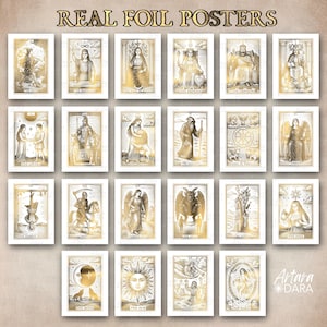 May include: A collection of gold foil tarot card posters, each framed in white. The cards feature detailed illustrations of figures and symbols, with titles like "The Moon" and "The Sun". The text "REAL FOIL POSTERS" is at the top.
