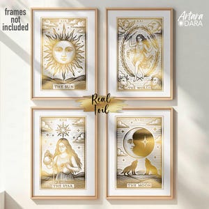 May include: Four framed tarot card prints with gold foil accents. The cards feature illustrations of the Sun, World, Star, and Moon. Each print has a white border and a wooden frame. The text "Real Foil" is also visible.